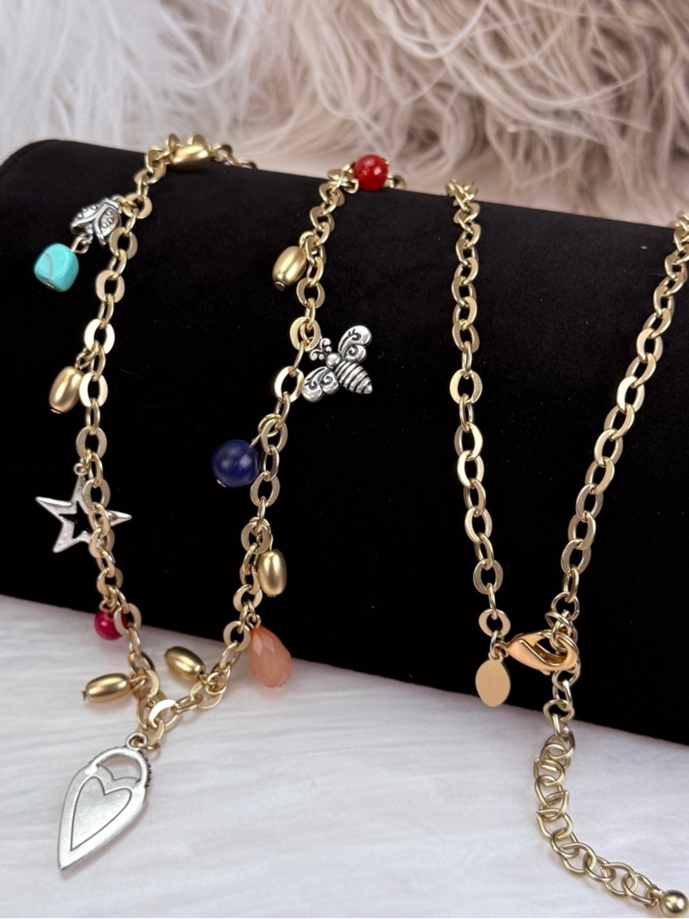 Beautiful goldtone, multi charm, double-sided pendant, long layering necklace